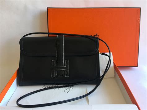 hermes men clutch|Hermes jige with strap.